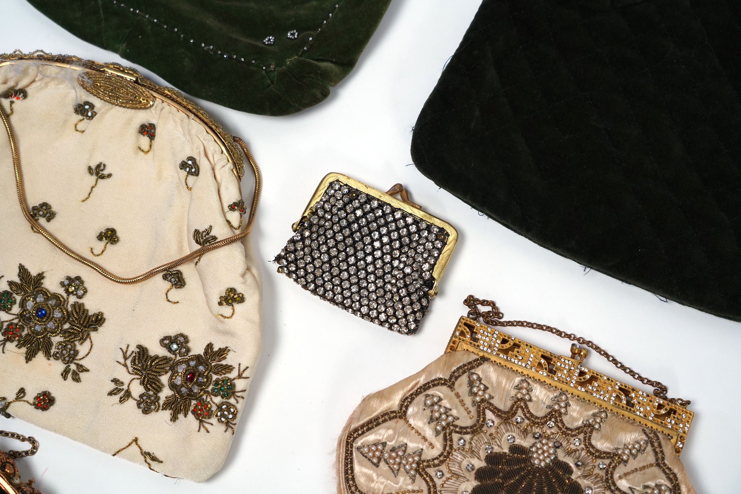 Mixed evening bags; including a 19th century velvet and cut steel handbag, a similar bag, three later gold metallic embroidered evening bags, a mixed metalic evening bag and a diamonte bag and purse (8)